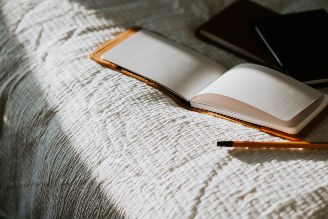 A serene workspace with an open journal, a pen, and calming elements like candles and plants, evoking a sense of self-discovery and reflection.