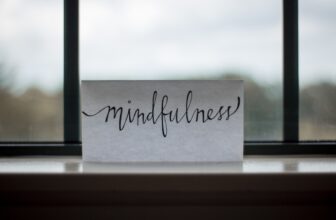A serene scene of a person meditating in a peaceful environment, surrounded by nature, embodying mindfulness and tranquility.